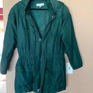 Women's light weight jacket with elastic waist and 2 front pockets.